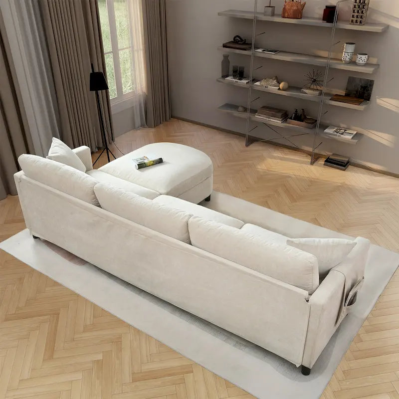 Divano 4 posti in tessuto beige con pouf mobile